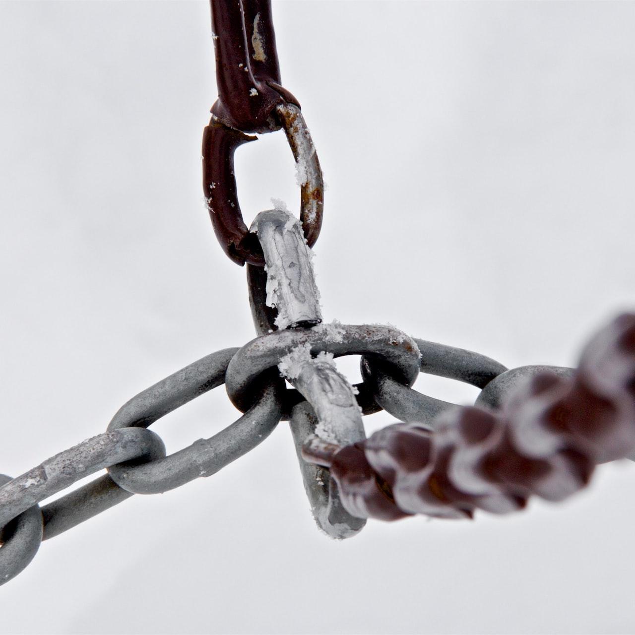 selective focus photograph of gray metal chains